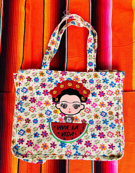 Bolsas de Yute 100% Mexicanas: Frida Kahlo Sandía con fondo claro de flores